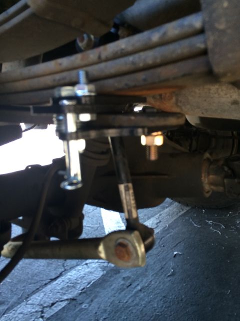1997 Dodge 3500 - Underside view of a truck's rear suspension components and hardware.