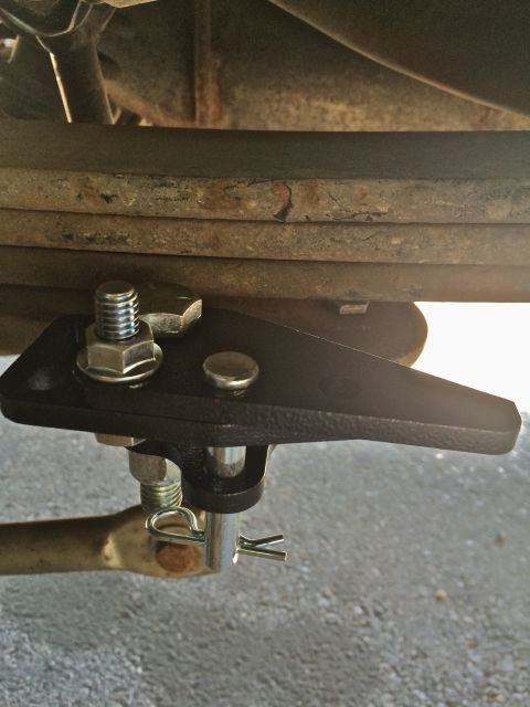 1997 Dodge 3500 - Detail of a vehicle's suspension system, showing a custom bracket and hardware.