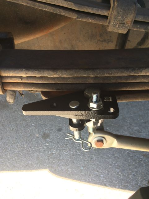 1997 Dodge 3500 - This photo shows a close-up view of a truck's suspension system, specifically a bracket attached to the leaf springs.