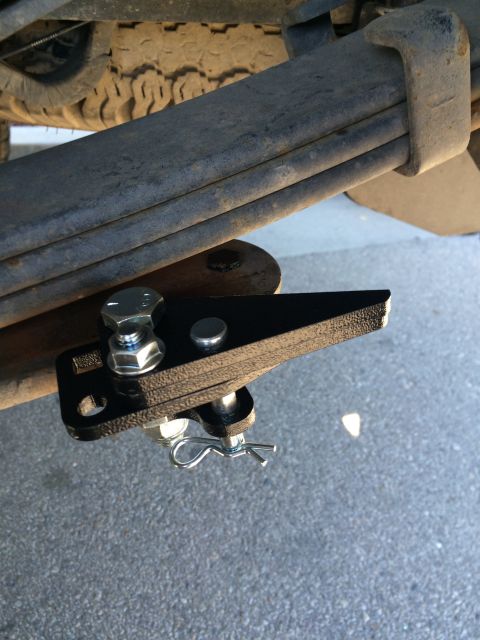 1997 Dodge 3500 - Close-up view of a trailer hitch receiver mounted to the underside of a vehicle.
