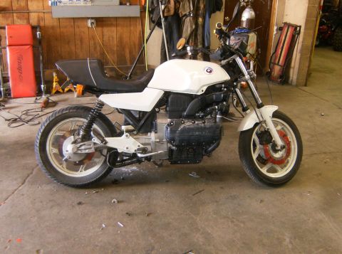 2000 Ford E350 - White BMW motorcycle in a garage setting, showing its side profile.