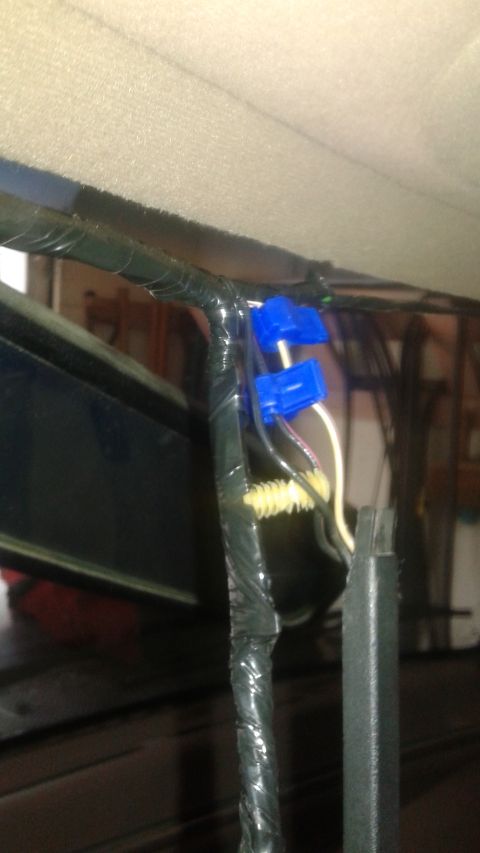 1996 Ford Bronco - This image shows a close-up of a vehicle's interior wiring harness, likely related to an accessory installation.