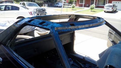 1972 Ford Ranchero - The interior frame of a vehicle is visible, with other cars in the background.