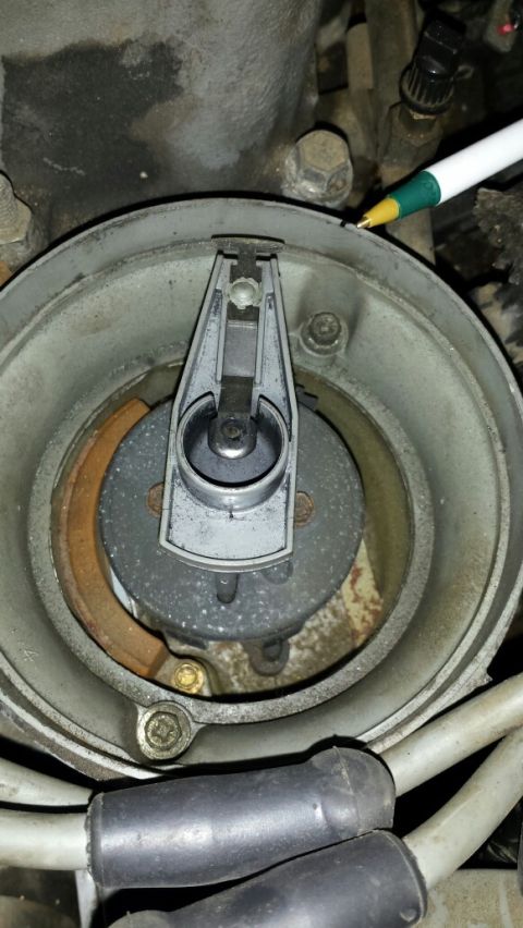 1989 Ford Bronco - Close-up view of a vehicle's distributor cap and rotor, a critical component of the ignition system.