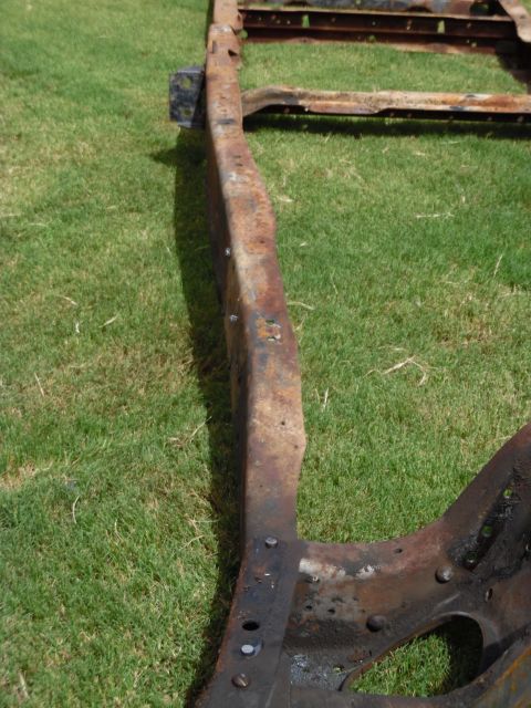 1993 Ford Bronco - It's very subtle, but the area where the radius arm bracket belongs is rolled inward. The rail is supposed to bend at the crossmembers, but…