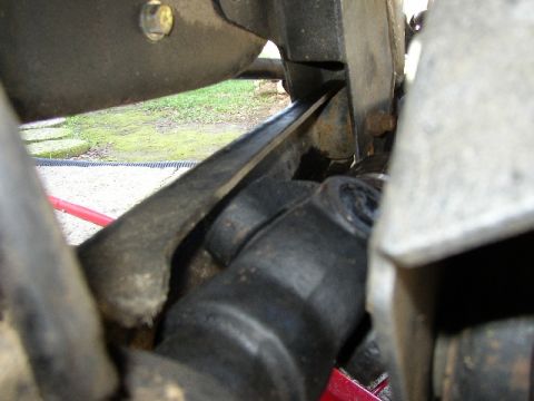 1989 Ford Bronco - This image shows a close-up view of a vehicle's driveshaft and suspension components, with a watermark for SuperMotors.net.
