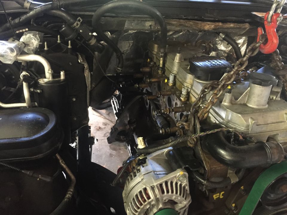 Diesel engine with tow hook and chain