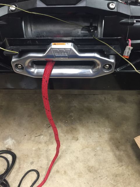 1994 Ford Bronco - WARN winch and red rope installed on a vehicle's front bumper.