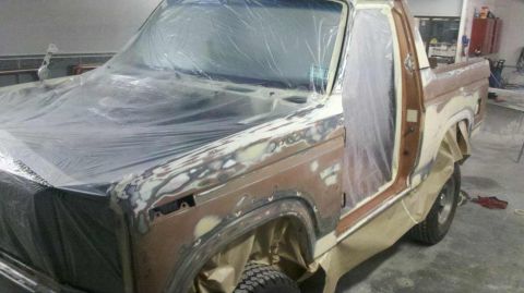 1982 Ford Bronco - This vehicle is undergoing bodywork and is covered in plastic sheeting and primer.