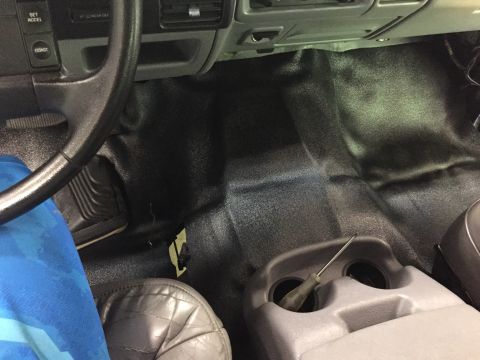 1994 Ford Bronco - Interior view of a 1994 Ford Bronco, highlighting the floor and dashboard area.