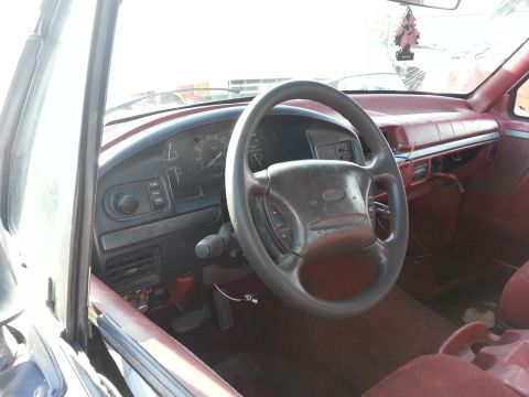 1994 Ford Bronco - Interior view of a 1994 Ford Bronco, highlighting the dashboard and steering wheel.