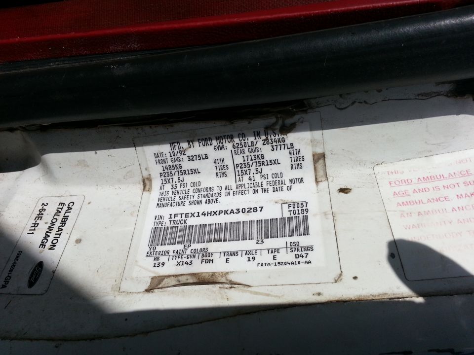'93 Ford F-150 certification label with GVWR, tire sizes, VIN and paint, axle and trans codes
