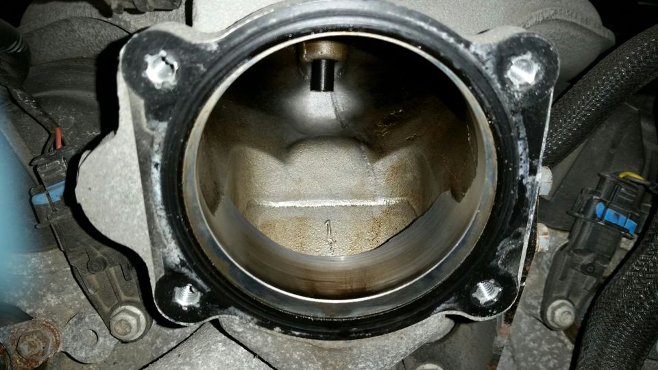 Non-ported throttle body removed.

Note the oil in the upper intake.
