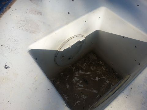 1973 Ford F-100 - Close-up view of the interior corner of a truck bed, showing a circular access panel.