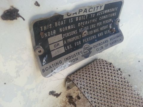 1973 Ford F-100 - A metal plate details the boat's capacity for persons and weight, with BIA markings.