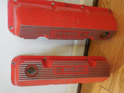 1973 Ford Mustang - Two red Shelby valve covers are shown, each horizontal silver stripes and the Shelby logo.