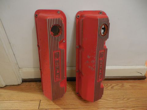 1973 Ford Mustang - Pair of red Shelby valve covers shown on a wooden floor.