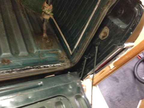 1979 Ford Bronco - The interior of a 1978 Ford Bronco shows wear and tear around the tailgate hinges.