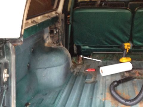 1979 Ford Bronco - The interior of a 1978 Ford Bronco shows cleaning supplies and tools.