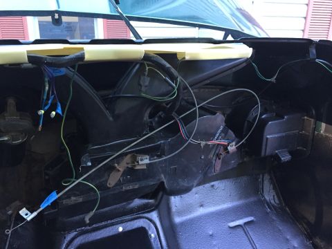 1979 Ford Bronco - The interior of a 1979 Ford Bronco reveals its complex wiring harness and HVAC system components.