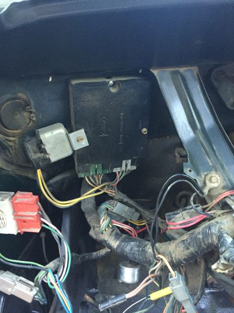 1979 Ford Bronco - This is a close-up view of the wiring harness and computer module located under the dashboard of a 1979 Ford Bronco. The module is black wi…