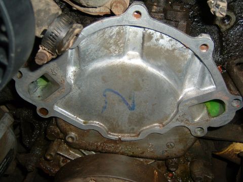 1987 Ford Bronco - This is a close-up view of a vehicle's water pump, a critical component for engine cooling.