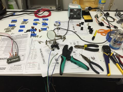 1979 Ford Bronco - A workbench is laid out with wiring components, tools, and instructions for a 1973-79 Ford F-100/350 & 1978-79 Ford Bronco Classic Update S…