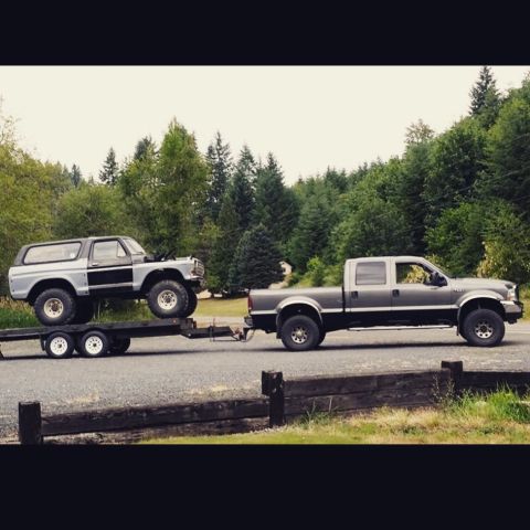 1979 Ford Bronco - A gray 1978 Ford Bronco is transported on a trailer by a Ford F-Series truck.