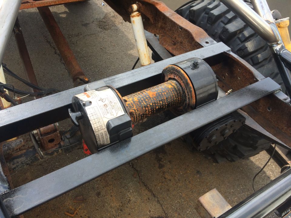 Winch mounted on vehicle frame, close-up