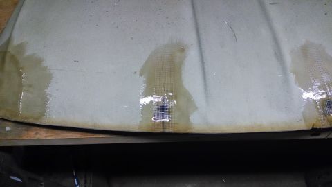 1992 Ford Bronco - Another weak spot to deal with. Used some fiberglass mesh tape and resin to reinforce. I'll deal with the hole from the other side.
