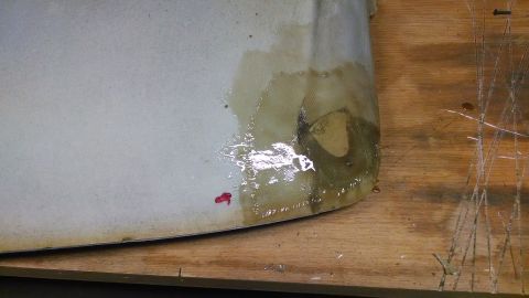 1992 Ford Bronco - The headliner shows signs of water damage and staining, with a small red mark visible on the surface.