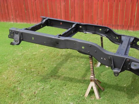 1993 Ford Bronco - Rear spring hangers going back on. The bolts are red-threadlocked.