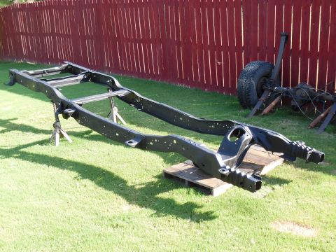 1993 Ford Bronco - Rear spring hangers going back on. The bolts are red-threadlocked.