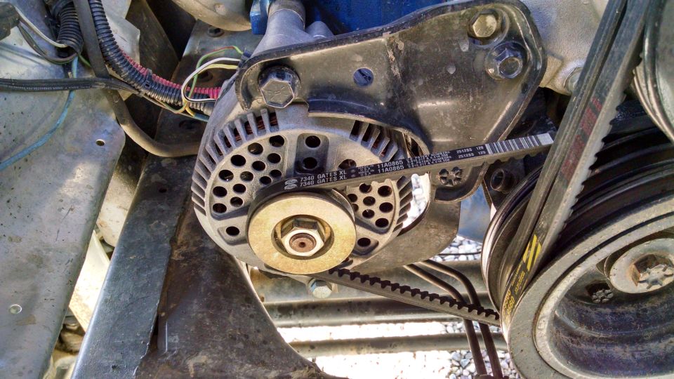 Close-up of vehicle alternator and Gates serpentine belt