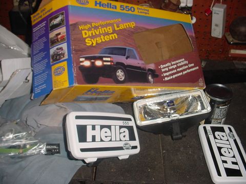 1988 Ford Bronco - The photo shows Hella 550 driving lamps and their packaging, not a 1988 Ford Bronco.