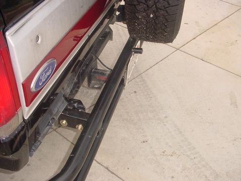 1988 Ford Bronco - Rear view of a 1988 Ford Bronco showing the bumper, spare tire mount, and hitch.