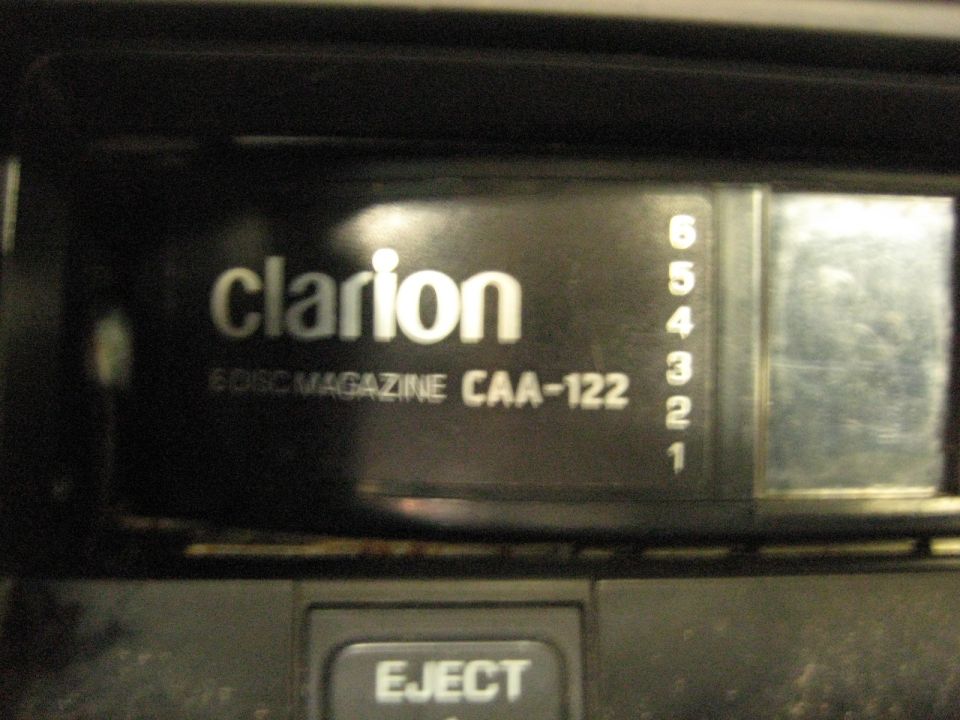 Clarion 6-disc magazine changer CAA-122 with disc selection numbers 1-6.