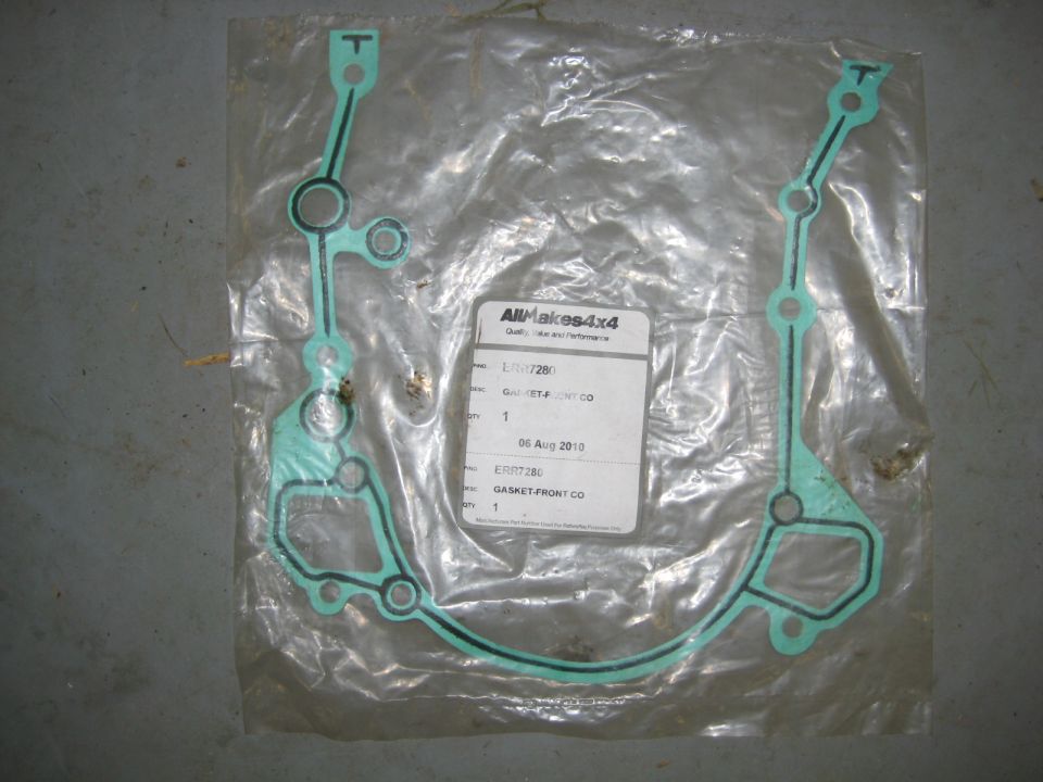 Green gasket with black edges in plastic packaging with a label.