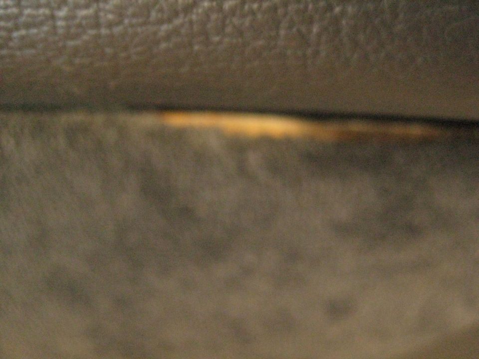 Close-up of textured interior surface with a horizontal light-colored line.