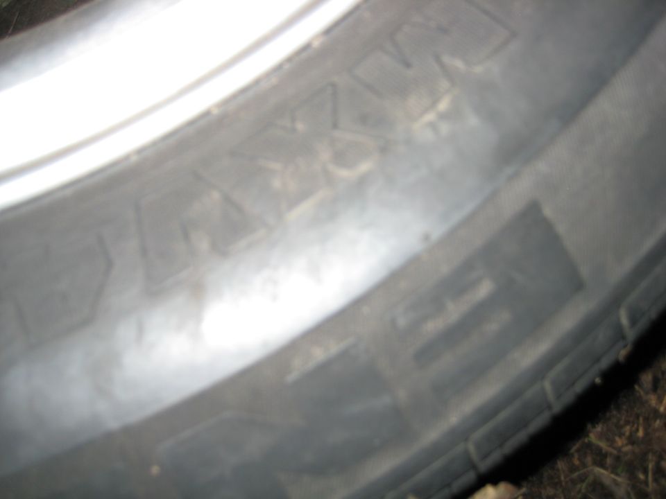 Close-up of a tire tread with embossed lettering.