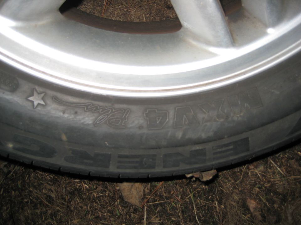 Close-up of a tire with NEXEN ENERGY text on a silver wheel.
