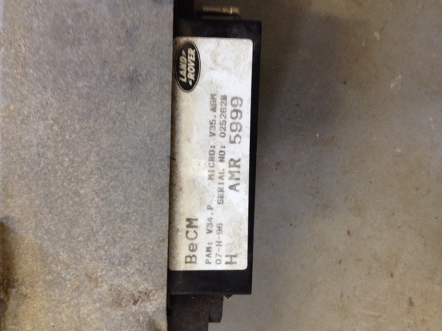 Land Rover BeCM electronic module label with part and serial numbers.