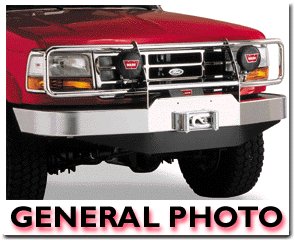 1989 Ford Bronco - Front three-quarter view of a red Ford truck fitted with a chrome/polished winch bumper and a full brush/grille guard, showing round auxili…