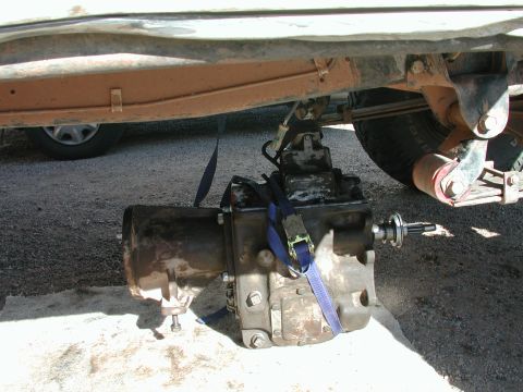 1987 Ford Bronco - here is the problem; 120+ lbs of NP435, gravel driveway and no one i can really depend on to help me throw it in...