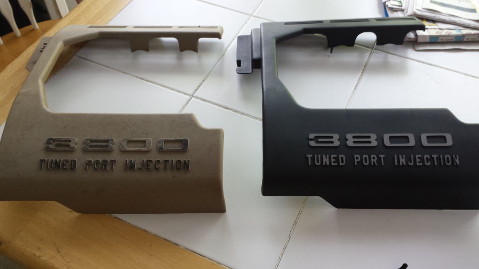 Tan and black engine covers with "3800 TUNED PORT INJECTION" text