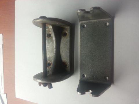 1973 Ford F-100 - Two metal brackets are shown against a white background, with a watermark at the bottom right.