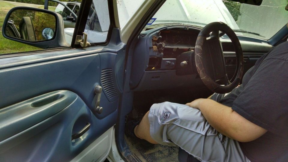 1996 Ford Bronco interior with blue door panel and dashboard