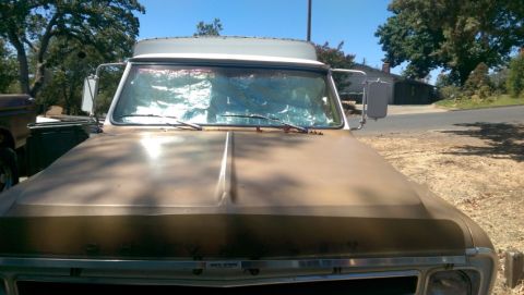 1968 Chevrolet C/K Pickup - Front view of a 1968 Chevrolet C/K Pickup truck with a camper shell.