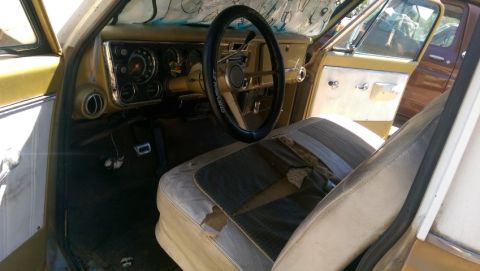 1968 Chevrolet C/K Pickup - Interior view of a 1968 Chevrolet C/K Pickup, a worn seat and dashboard.