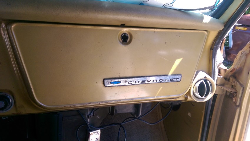 1968 Chevrolet C/K Pickup interior dashboard with Chevrolet emblem on glove box door and air vent